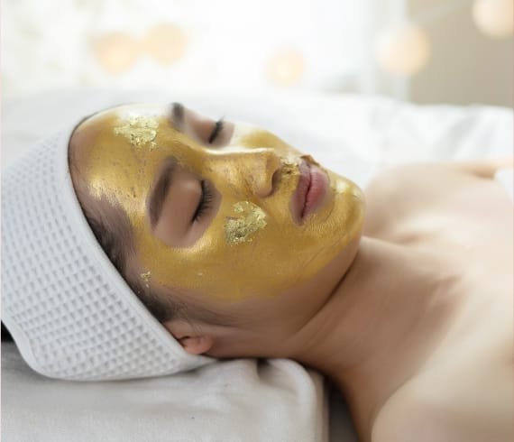 Indulge in the Opulence of Our 24K Gold Facial!